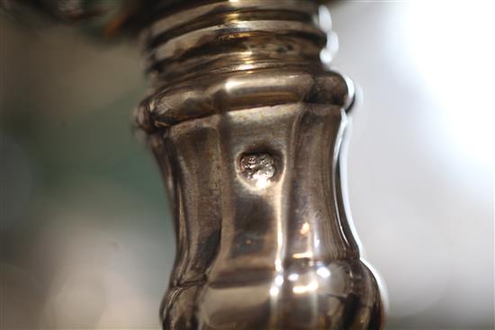 A matched set of four late 18th century silver candlesticks, engraved with the Heneage family crest,